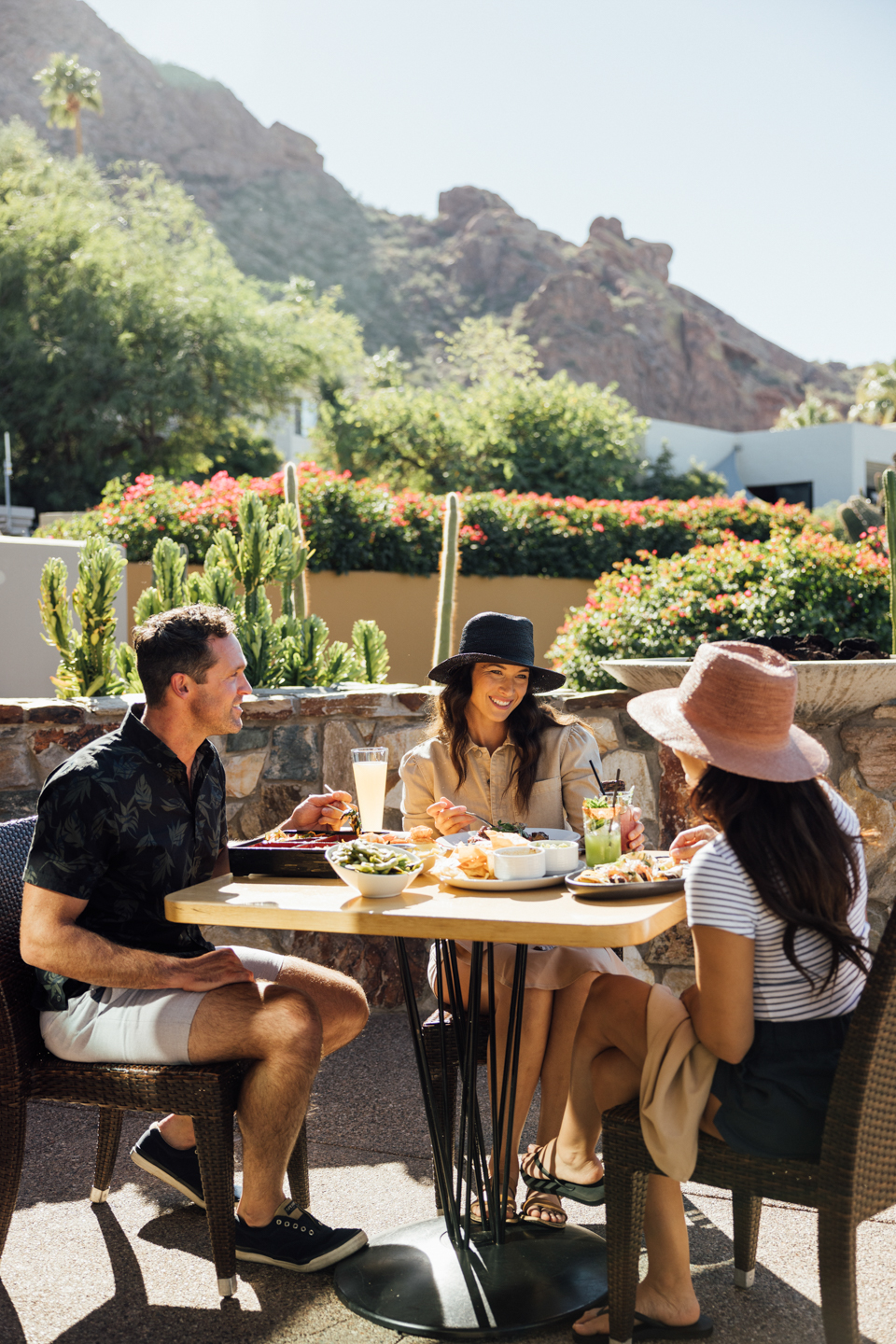 Friends enjoying brunch on elements' Praying Monk Patio.