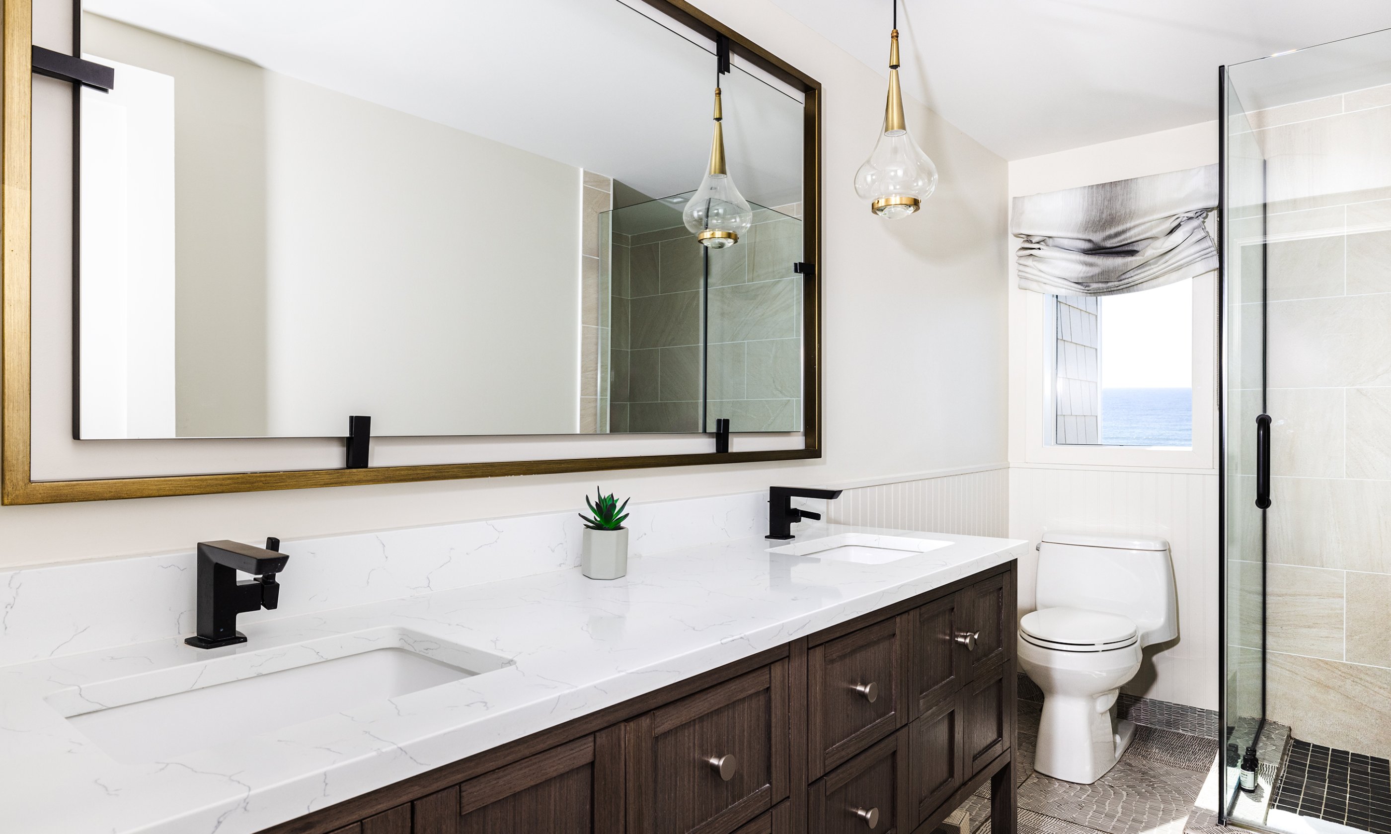 The primary bathroom in the Ocean View Three Bedroom Cottage at Gurney's Montauk Resort