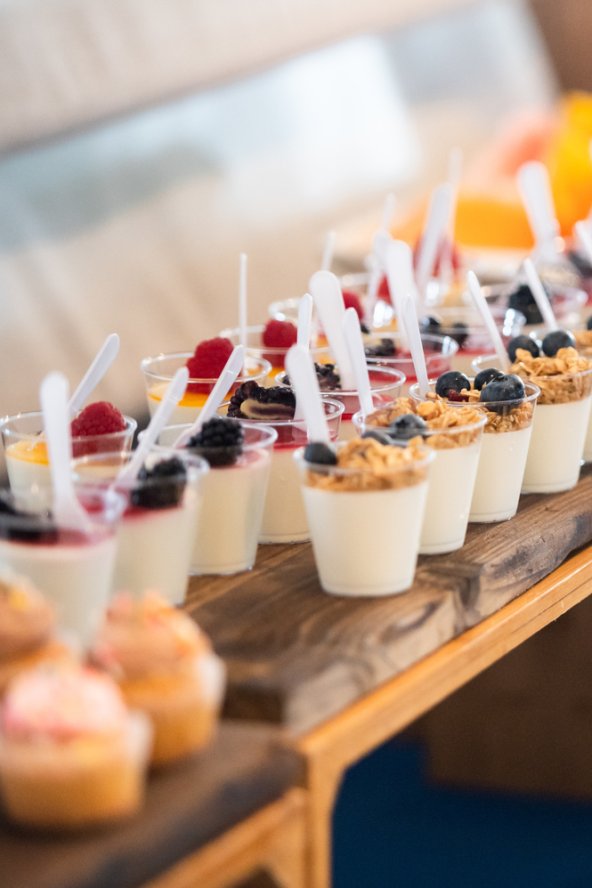 A buffet setup including parfaits and pastries