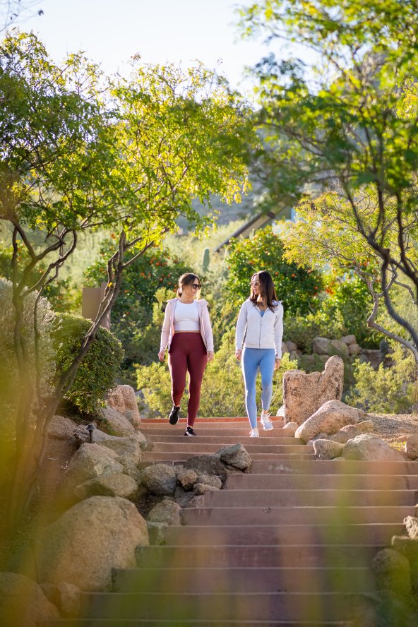 Women walking on pathway