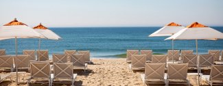 beach with chairs and umbrellas