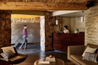 Sanctuary lobby with front desk attendant and sitting area.