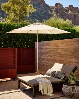 Lounge seat and umbrella on Terrace Casita patio.